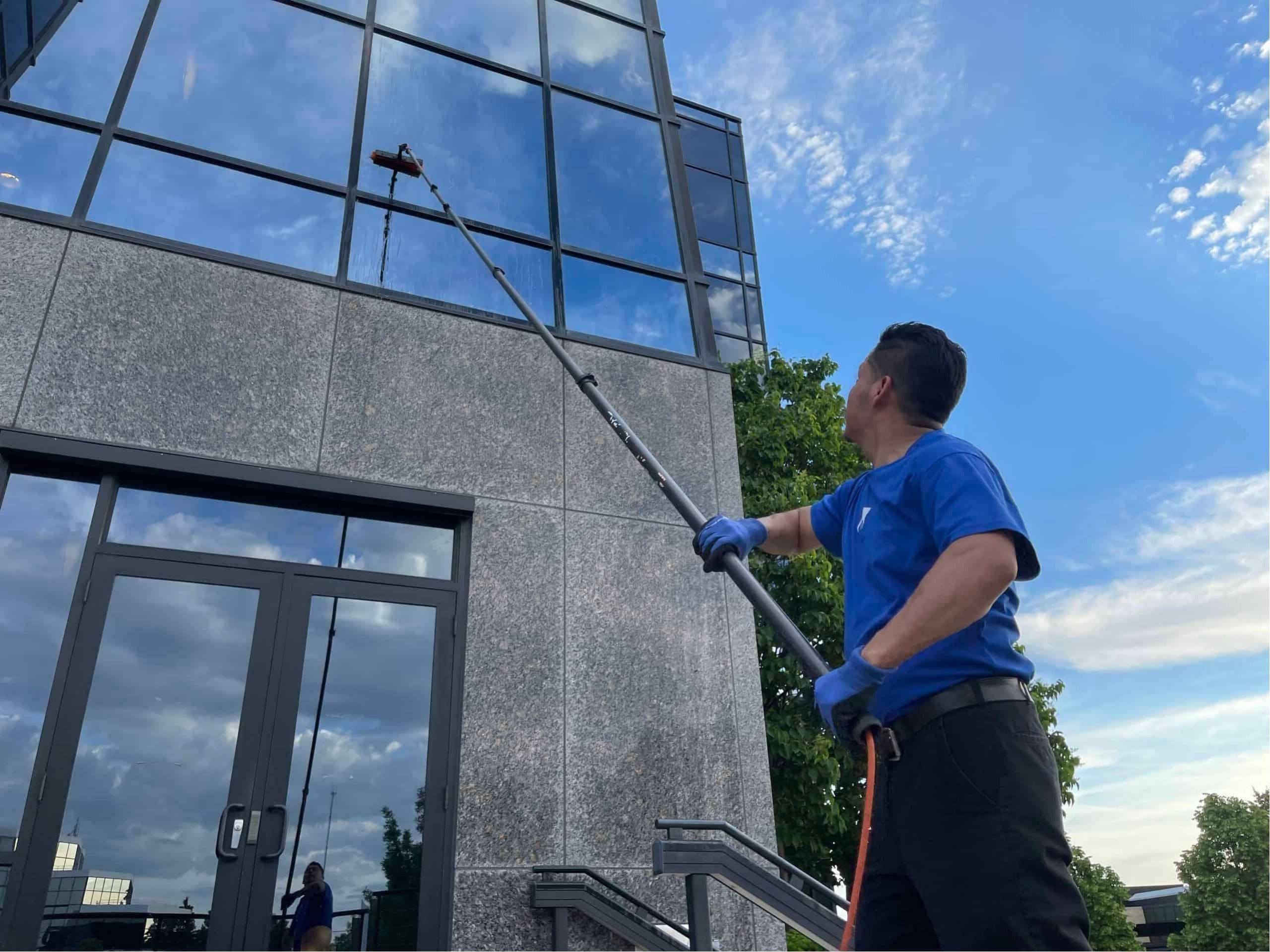 man cleaning windows