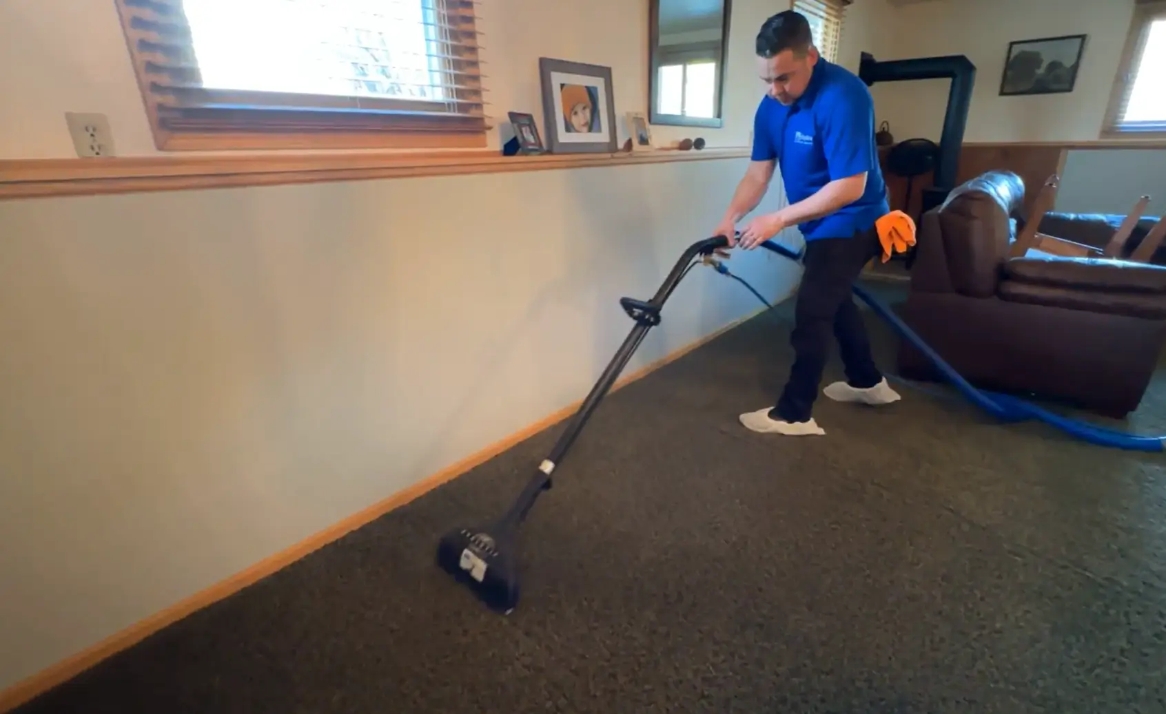 2 men using carpet cleaning machine